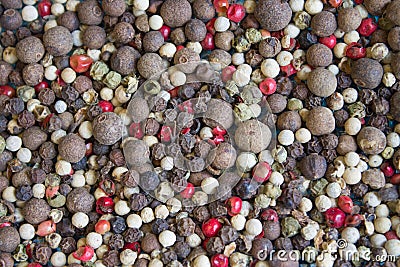 Background of a mixture of dry pepper peas black, red, white colors Stock Photo