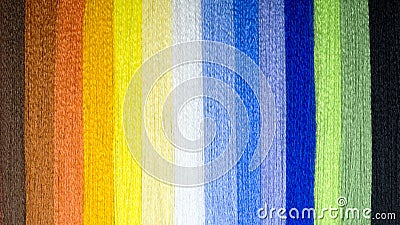 Background from multi-colored threads. A rainbow of thread. Stock Photo