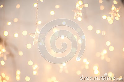 Background of New Year`s garlands like stars. Christmas atmosphere with garlands in focus and defocus Stock Photo