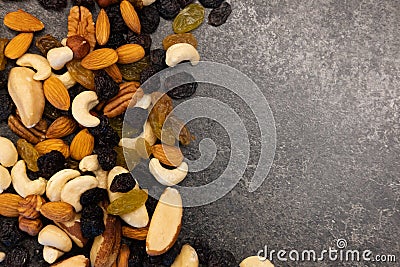 Background of nuts - pecan, macadamia, brazil nut, walnut, almonds, hazelnuts, pistachios, cashews, peanuts, pine nuts - with copy Stock Photo