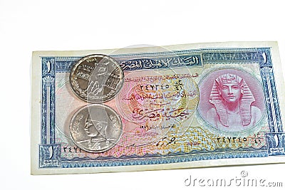 Background of old Egyptian money banknotes and coins of One Egyptian pound 1 EGP LE banknote bill of king Tutankhamen and coin of Stock Photo