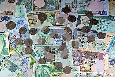 Background of old Libyan money banknote bills and coins of different eras from the kingdom to Jamahiriya of Libya times, vintage Stock Photo