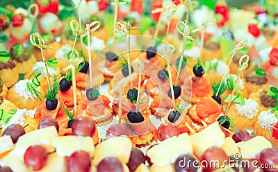 Background of party appetizers on wooden sticks. Stock Photo