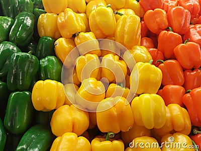 Green yellow and orange peppers Stock Photo
