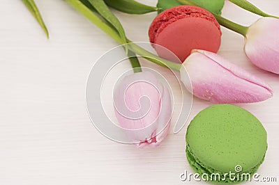 Background with pink tulips and macaroons. Stock Photo