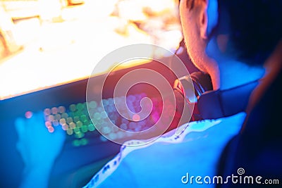 Background professional gamer playing championship online games computer with headphones Stock Photo