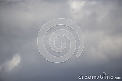 Background of real heavy clouds. Background summer sky. Gray background. Gray sky background with tiny clouds Stock Photo
