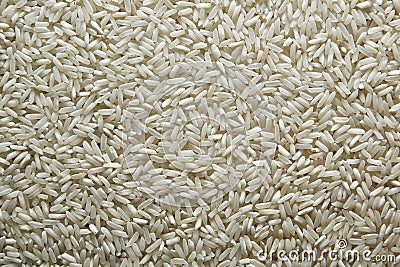 Background of rice. Rice texture. Rice grains closeup. Top view Stock Photo