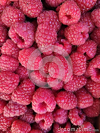 Background ripe raspberries, abstract flat layout, food photo fruit composition top view, crimson mottled layout Stock Photo