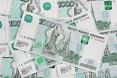 Background of scattered banknotes Russian ruble denomination one thousand rubles Stock Photo