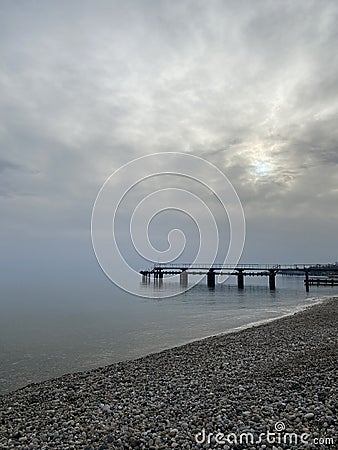 background, seascape - the sea in the distance merges with the sky in the morning mist Stock Photo