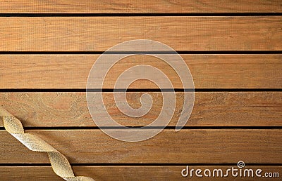 Background with shiny golden ribbon with ringlets on wooden table Stock Photo