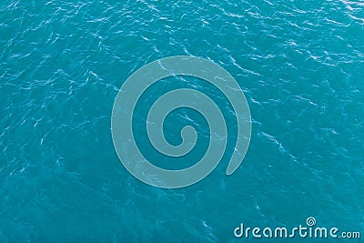 Background shot of aqua sea water surface. Sea surface aerial view. Waving water surface of the sea background Stock Photo