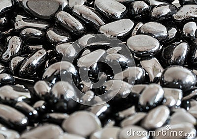 Background of silver haematite nuggets of oxidized iron ore Stock Photo