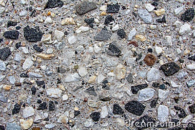 Background of small pebbles in a concrete wall Stock Photo