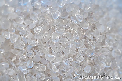 Background of small polished quartz and rock crystal stones in a giant pile Stock Photo