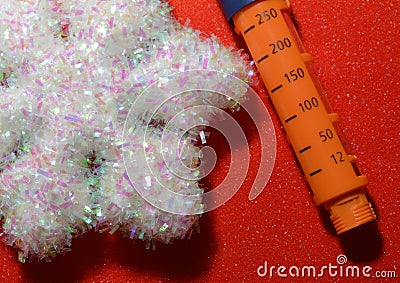 On a background snowflake with a syringe pen for the introduction of insulin to a patient with diabetes Stock Photo