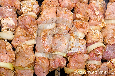 Background of spicy kebabs laid out on a grill Stock Photo