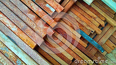 the background of a stack of coconut wood neatly arranged ready to be used as building construction material Stock Photo
