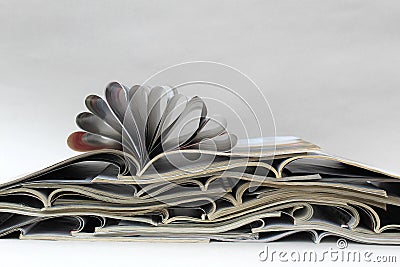 Background a stack of open glossy magazines, press Stock Photo