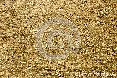 Background of stone with gold flecks. Stone rock with gold particles. Stock Photo