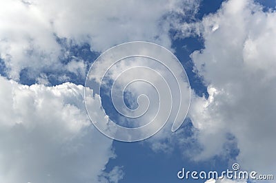 Background summer sunny bright blue sky with clouds and sun rays Stock Photo