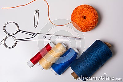 Background for tailor multicolored threads and scissors Stock Photo