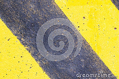 Background or texture Abstract. Top view of Yellow black caution warning lines on concrete floor grunge . Stock Photo