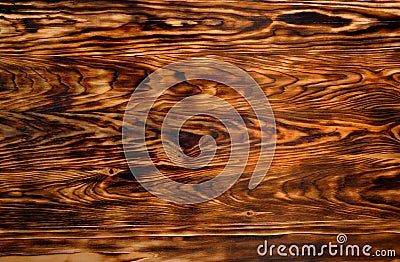 Background texture from burned brown pine wood Stock Photo