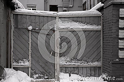 Background texture gray broken paint on old garage wooden door with a lock. Selective focus Stock Photo