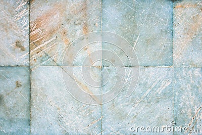 Background with a texture of old, scratched natural stone. The wall is a tiled bottom of marble. Stock Photo