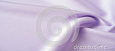 Background texture, pattern. Lilac silk fabric. It is a smooth, matte finish, and it gets its lightness from twisted yarns. Stock Photo