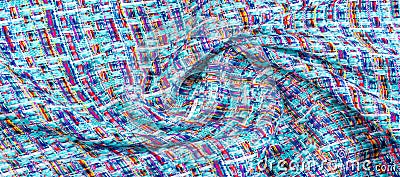 Background texture, pattern. Winter fabric, warm. big braided thread. Blue-red yellow threads. This photo will make your design Stock Photo