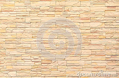 Background and texture of yellow decorative stone wall surface Stock Photo