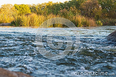 Background, top view, rapid flow river with dark blue water and white foam waves Stock Photo