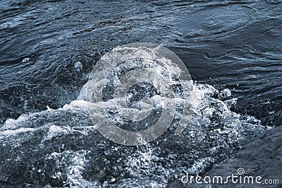 Background, top view, rapid flow river with dark blue water and white foam waves Stock Photo