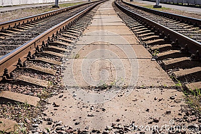 Background, two vintage railway lines, stretching into the distance, on the whole frame. Horizontal frame Stock Photo