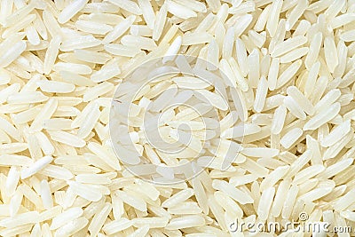 Background - uncooked polished long-grain rice Stock Photo