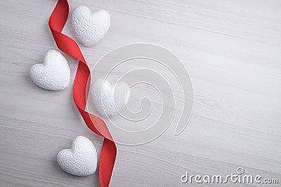 Background for Valentine`s Day greeting card.Valentines day concept.Red gift ribbons, gifts, hearts on a wooden background. Top Stock Photo