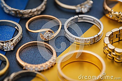 Background from various gold rings on colored paper Stock Photo