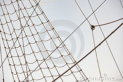 Background from vintage rigging rope system with pulley Stock Photo