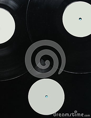 Background of vinyl records, top view. Retro music technology. Stock Photo