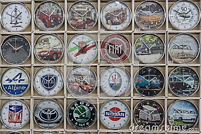 Background of a wall clock with the logos of well-known automotive companies (retro and modern) Editorial Stock Photo