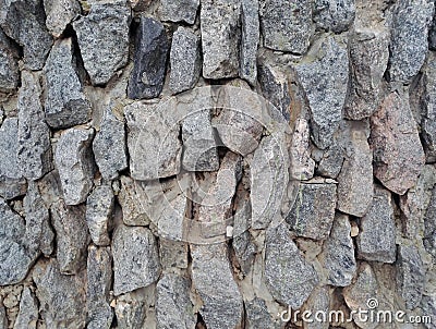 background wall stacked natural rough stones Stock Photo