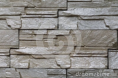 Background of a wall stacked with stone blocks Stock Photo
