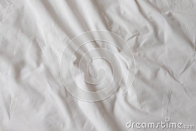 Background of white rumpled sheets. Bed linen with wrinkles in day light. Horizontal. Copy spase. Concept of rest, awakening, Stock Photo