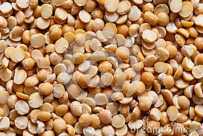Background of yellow dried split peas. Stock Photo