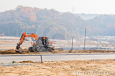 Backhoe at construction site Editorial Stock Photo