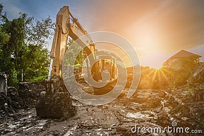 Backhoe to excavate the soil on the ground construction site Stock Photo