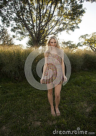 Backlit Blond in Sun Dress Stock Photo